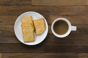 Biscuits sprinkle sesame and hot coffee.