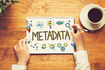 Metadata text with a person holding a pen