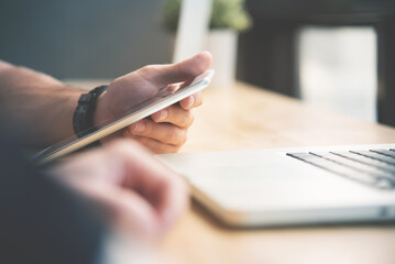Businessman holding tablet while discussing Business table at the office. Laptop on wooden.