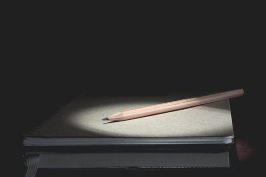 Education concept, Equipment and supplies for work on a wood table.,dark tone.