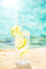 Water with ice at the edge of a resort pool. Concept of luxury vacation