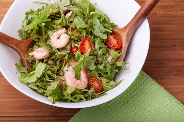 Fresh organic salad with shrimp and arugula, healthy food