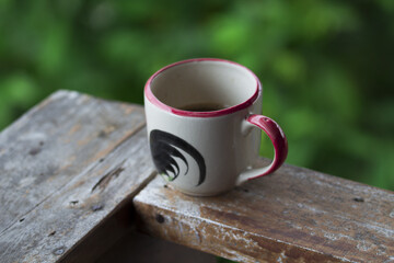 Coffee mug with green background
