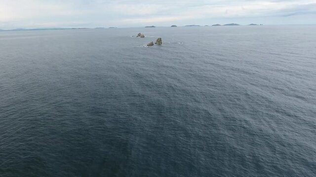 Wide open ocean forward flight giant waves. Far East marine reserve. Vladivostok unique national Park best of Russia nature. Stormy dark clouds. Epic cinematic aerial drone 4k ultrahd.