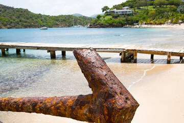 Fototapeta premium Old anchor in the Galleon beach. Antigua, Caribbean islands, English Harbour 