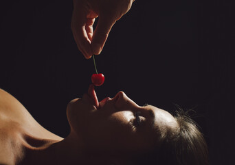 Sexy Woman Eating Cherry.