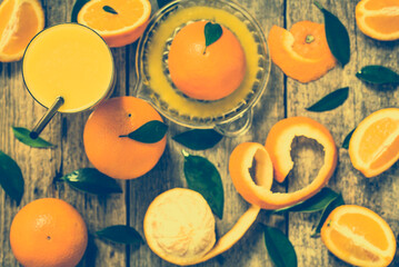 Glass of orange juice squeezed from fresh oranges fruits, flat lay, overhead