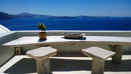 Beautiful place in Oia with a table and chairs for romantic meetings - great view of the bright blue sea