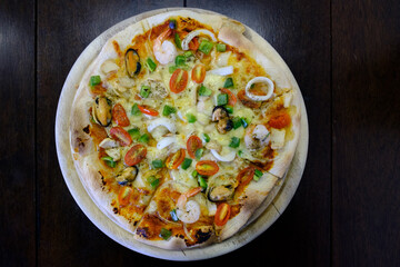 seafood pizza isolate on wood table, Top view