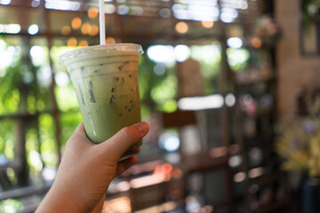 Iced Matcha green tea in cafe.