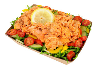 Pink salmon and fresh salad in a cardboard food tray isolated on a white background