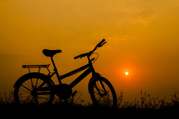 Fototapeta premium Bike silhouette and sunset light.