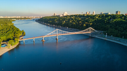 Aerial top view of pedestrian Park bridge and Dnieper river from above, city of Kiev, Ukraine
