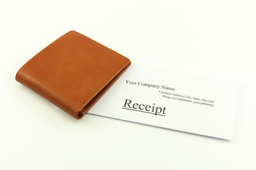 Brown wallet with receipt on a white background