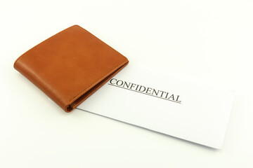Brown wallet with confidential on a white background
