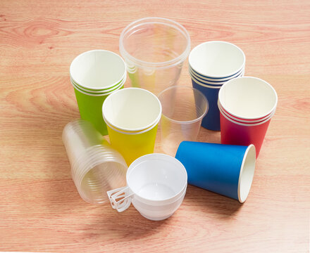 Different disposable plastic cups and paper cups in different colors