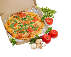 Cooked pizza in cardboard box, tomatoes, mushrooms and arugula