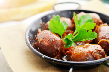 Roasted chorizo sasuage on balck pan