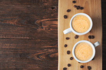 White cups of espresso on a wooden tray,coffee bean,flat lay
