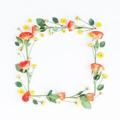 Flowers composition. Frame made of orange rose flowers on white background. Flat lay, top view