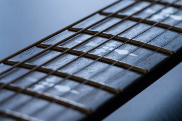 Electric guitar at black background