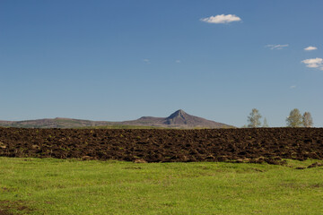 landscape with mountain and tilled ground