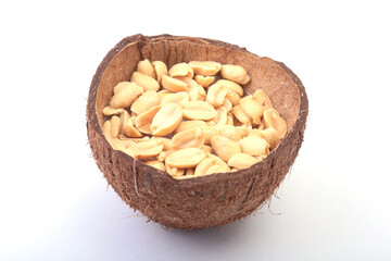 Roasted peeled peanuts in Handmade bowl of coconut, Selective Focus