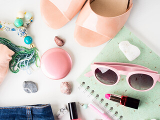 Summer color lifestyle woman clothes flat lay with accessories, make up and sandals