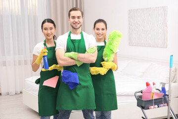 Cleaning service team at work in bedroom