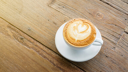 Hot coffee on a wooden table.