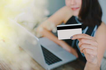 Young asian woman shopping online.