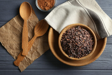 Composition with cocoa nibs on wooden table