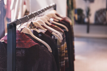 Fototapeta na wymiar Woman clothing on racks in a store in Paris
