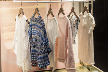 Woman clothing on racks in a store in Paris