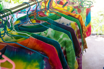 colorful clothes on  hangers in market