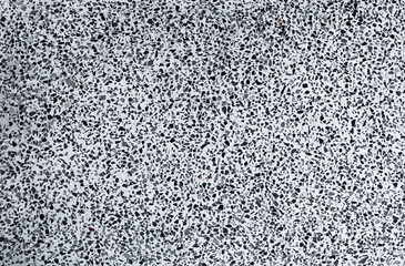 Texture stone paving of black pebble wall for pattern and abstract dark background