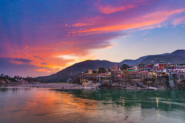 Dusk time at Rishikesh, holy town and travel destination in India. Colorful sky and clouds...