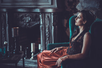 Beautiful bride sits on a chair. Luxury palace. - Powered by Adobe