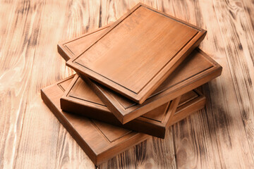 Stack of rectangular wooden boards on table