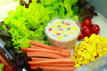 fresh vegetables salad in plastic container