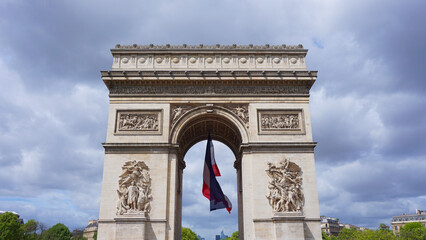 Fototapeta na wymiar Photo of Arc de Triomphe on a cloudy spring morning, Paris, France