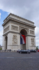 Fototapeta na wymiar Photo of Arc de Triomphe on a cloudy spring morning, Paris, France