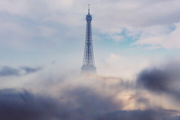 Dramatic sky and Eiffel tower in Paris, storm is coming,  France - Powered by Adobe