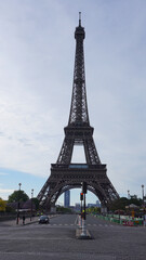 Fototapeta na wymiar Photo of Eiffel Tower on a spring cloudy morning, Paris, France