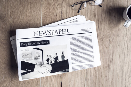 Newspaper on wooden table