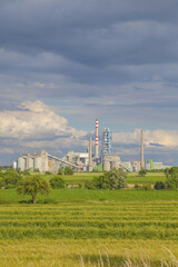 Fototapeta na wymiar View of a cement plant with blue sky
