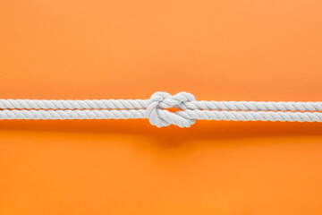 White ship ropes connected by reef knot - obrazy, fototapety, plakaty