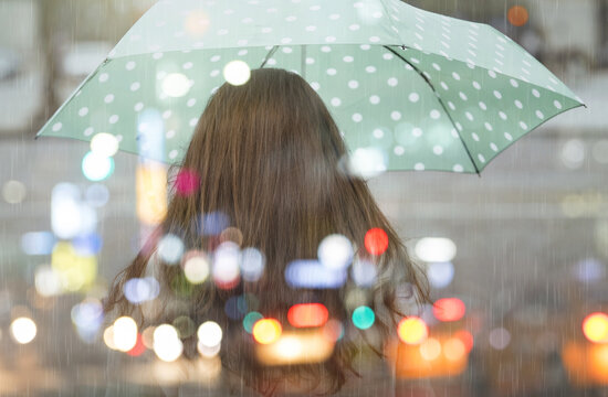 Alone girl in Paris, rainy day