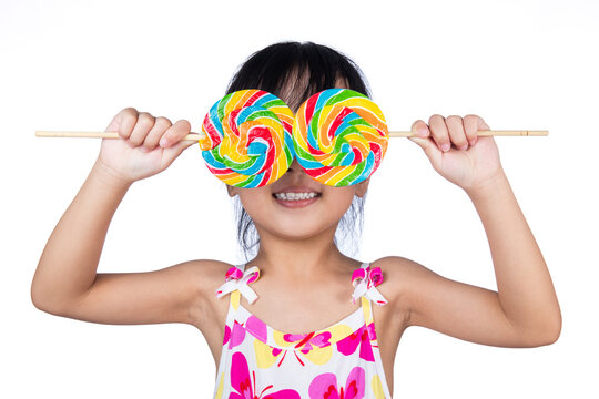 Asian Little Chinese Girl Holding Lollipop