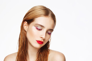 Obraz premium Close-up portrait of young beautiful girl with bright make up. White background. Isolated.